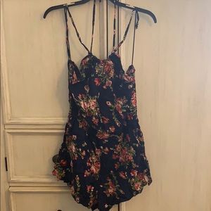 Floral print pocket halter romper. Brand new
